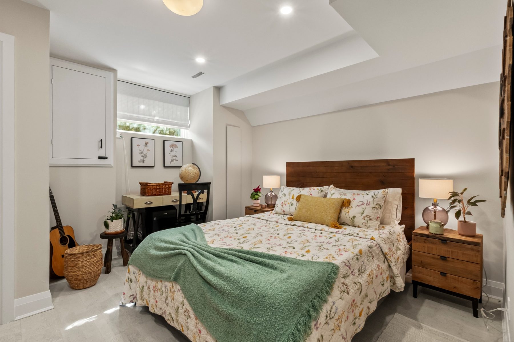 Basement bedroom with a window, pot lights and closet