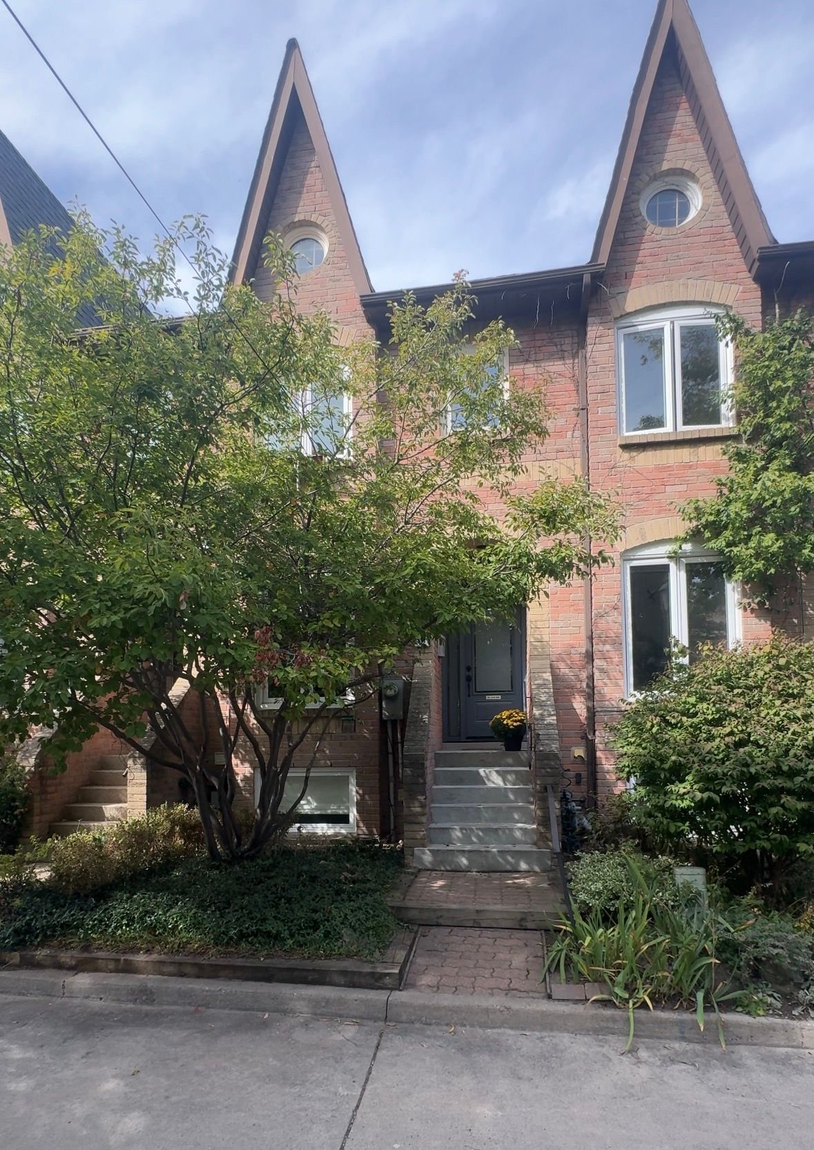 Front of 12 St James Ct. with its steps and front garden